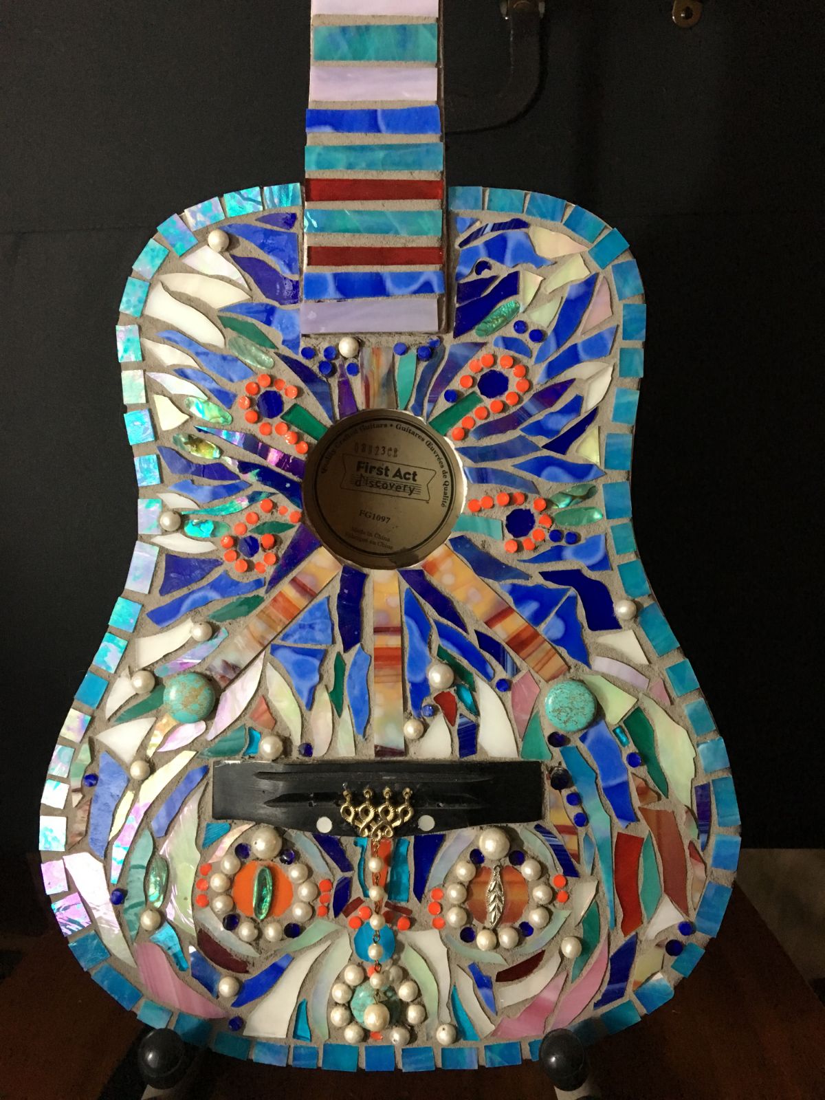 A picture of a mosaic guitar.